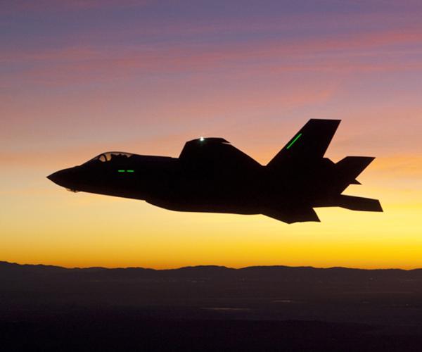 F-35 first night flight -- plane against sunset sky
