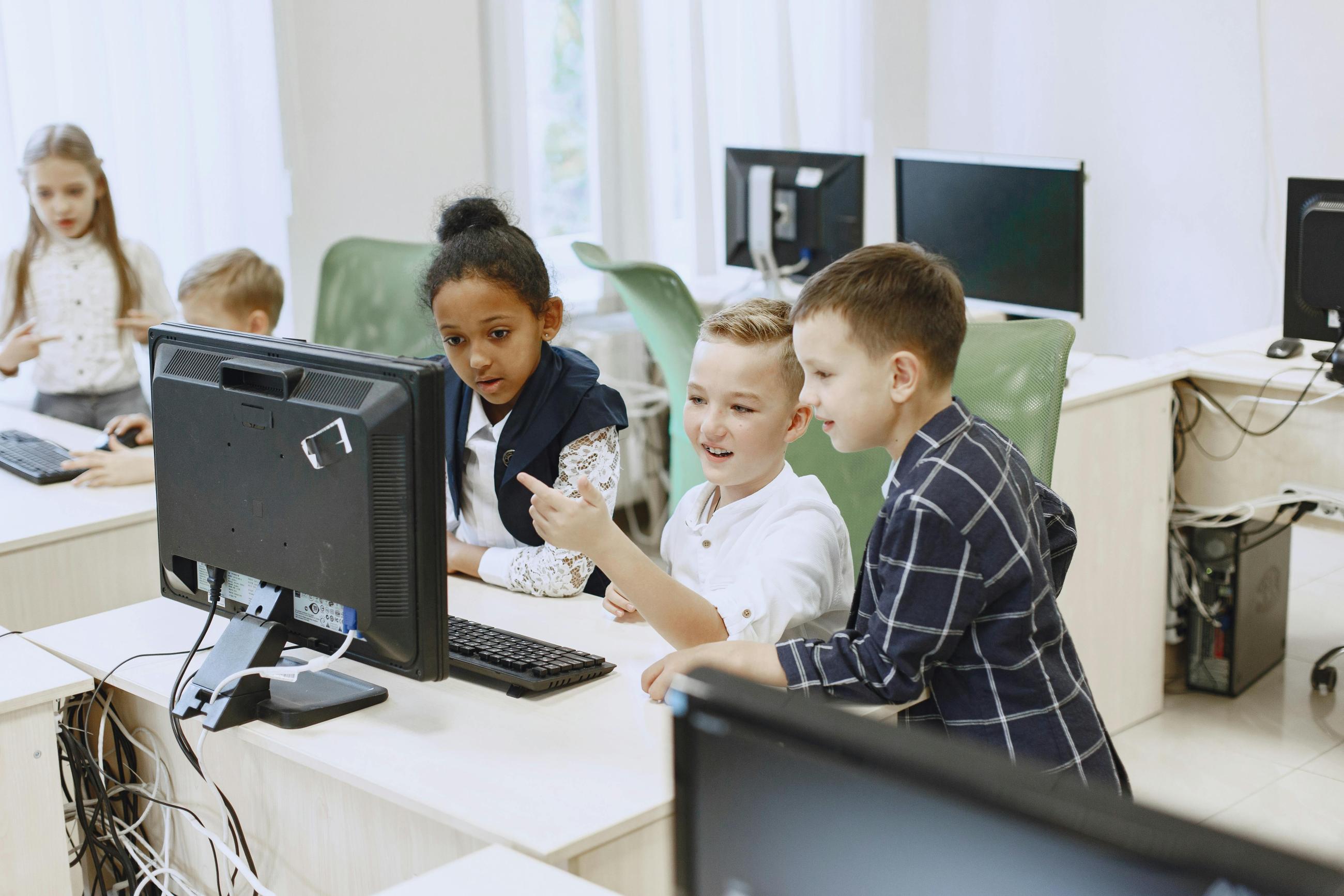 Young children looking at a computer screen