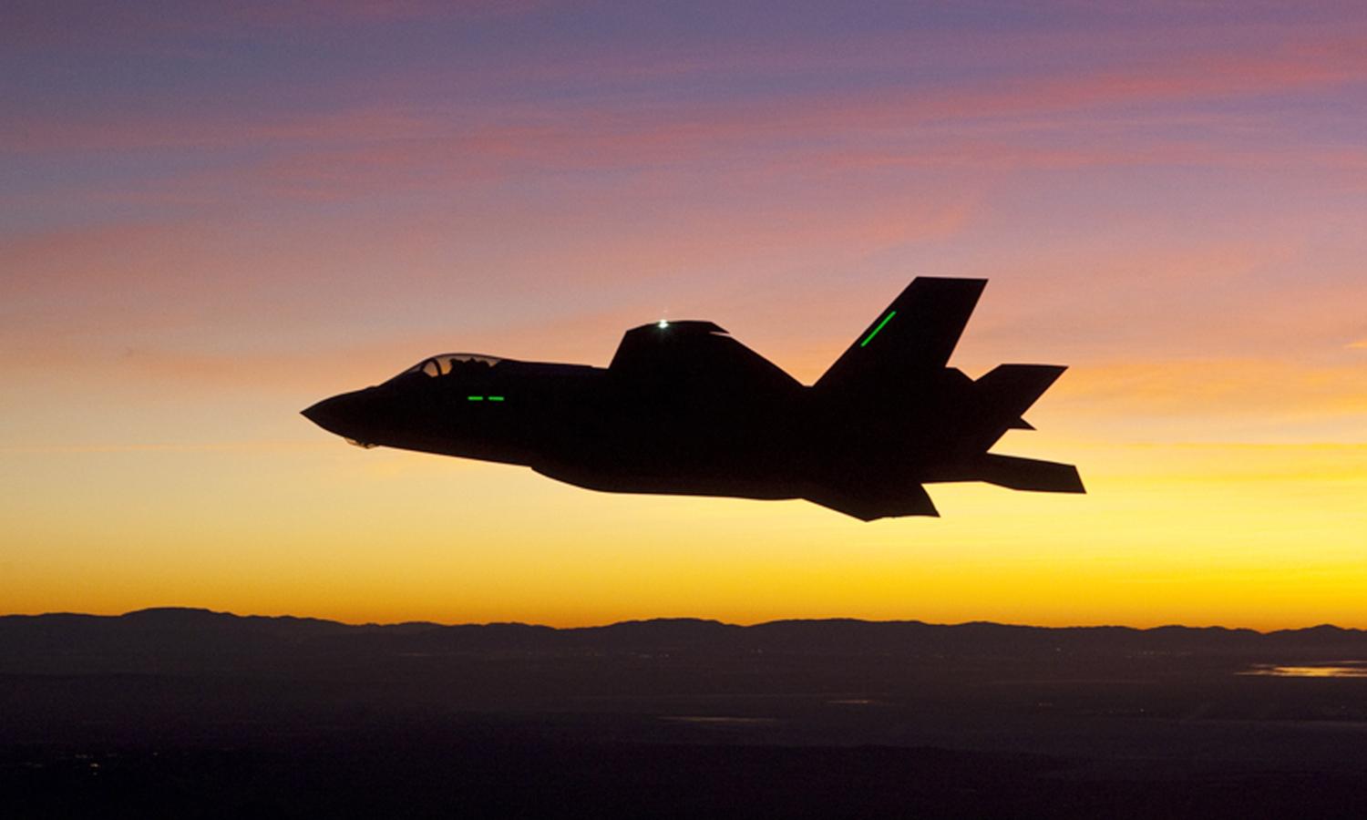 F-35 first night flight -- plane against sunset sky